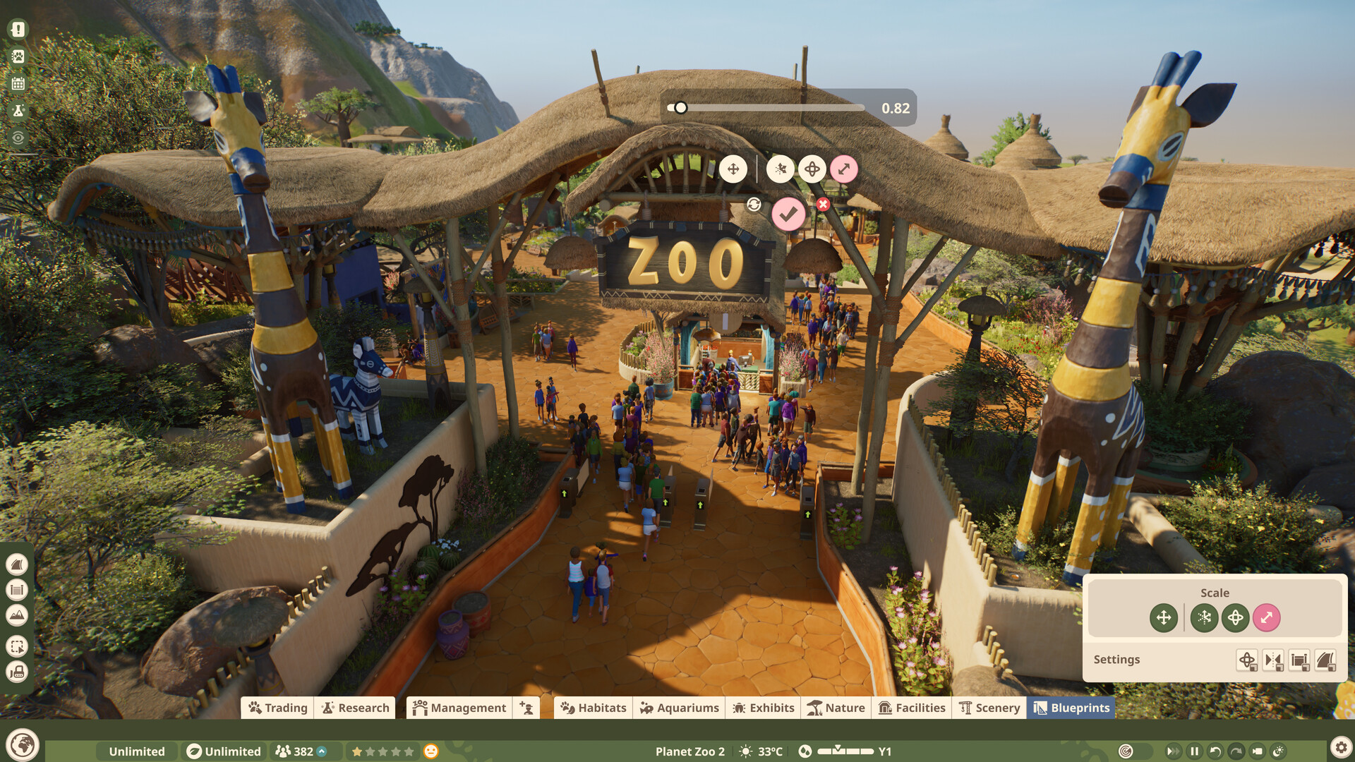 Planet Zoo 2, ingresso dello zoo con visitatori, statue di giraffe e strumenti di costruzione